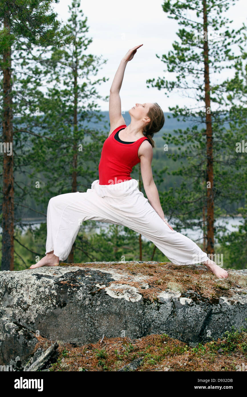 Young woman doing yoga Stock Photo
