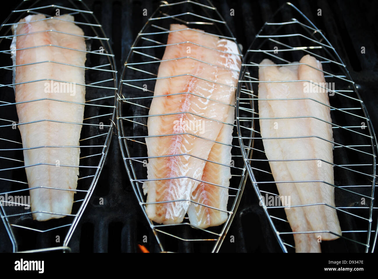 Grilling Healthy White Fish for Dinner Stock Photo
