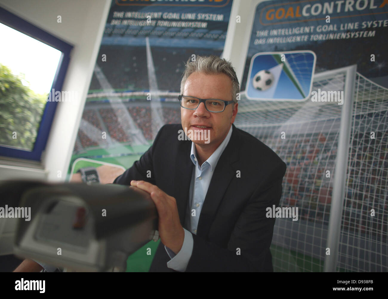 (FILE) - A file picture dated 23 May 2013 shows managing director of company GoalControl, Dirk Broichhausen, presents a goal camera in Wuerselen, Germany. The company intends to install its technology for Confederations Cup 2013 (15-30 June) in Brazil. GoalControl will install seven cameras on each side of the goal, which measure the position of the ball to the goalline and transmit the information to the referee within a second. Photo: OLIVER BERG Stock Photo