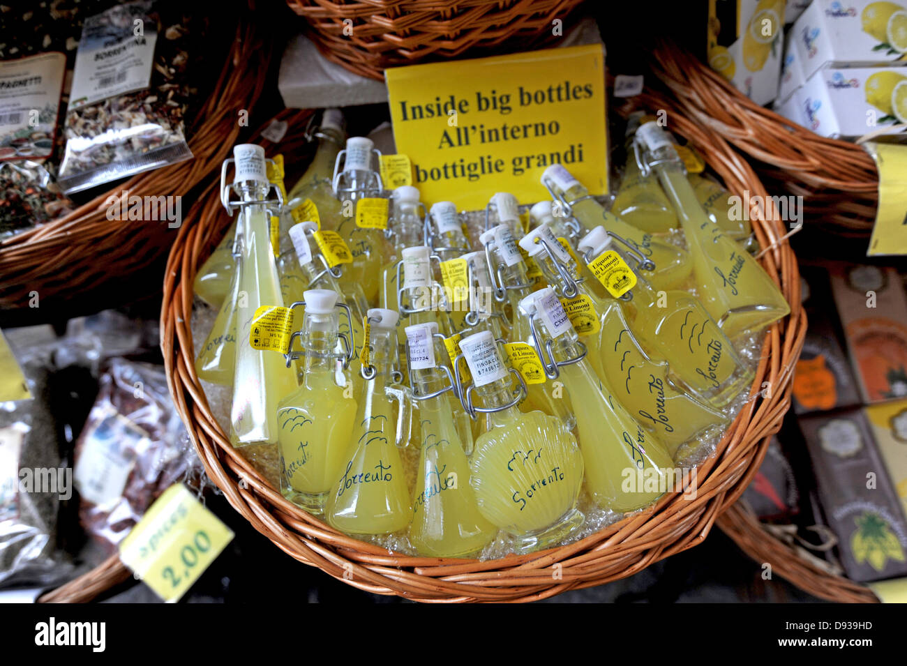Bottles of Limoncello for sale inside a tourst gift shop in Sorrento Stock Photo