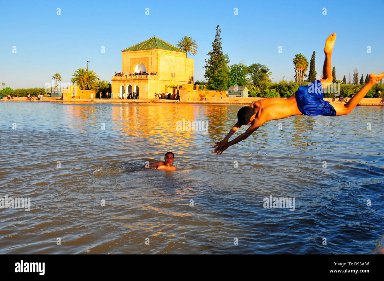 Young's bathing at The Menara gardens , Marrakech, Morocco, North Africa. Stock Photo