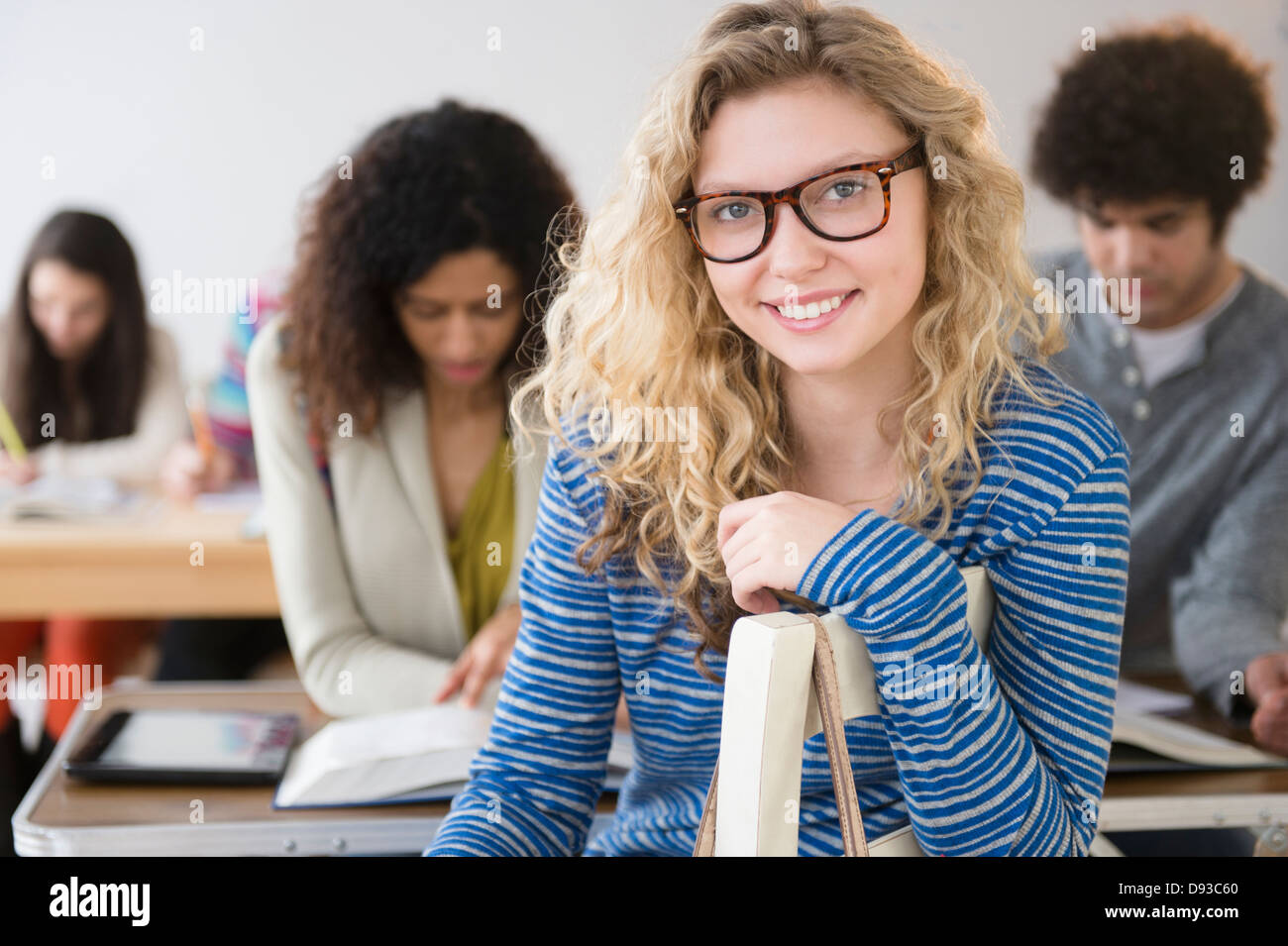 Student smiling in class Stock Photo
