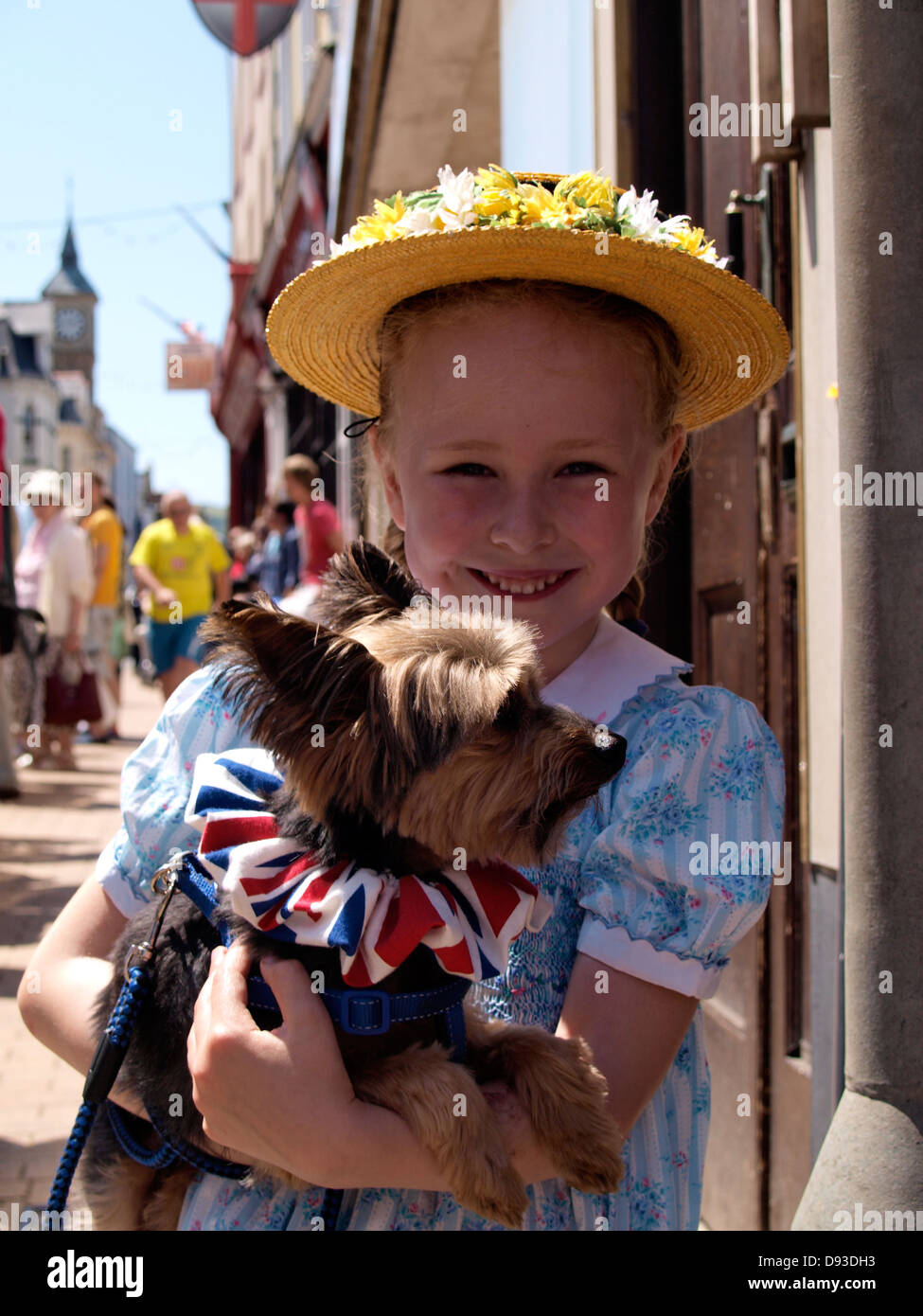 Young girl with her dog, Ilfracombe Victorian Celebration Parade, Devon, UK 2013 Stock Photo