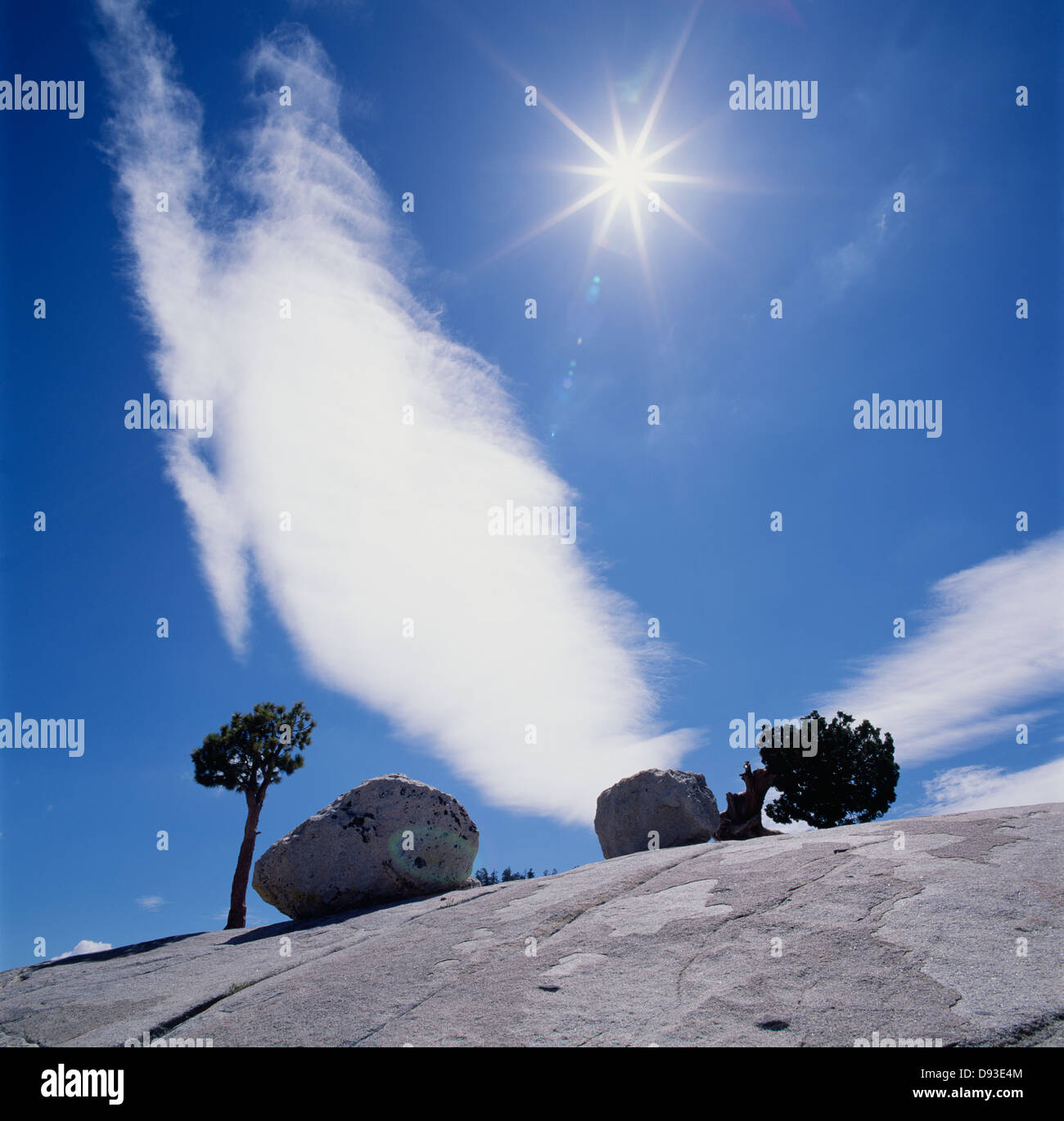 Rocks with sun in background Stock Photo - Alamy