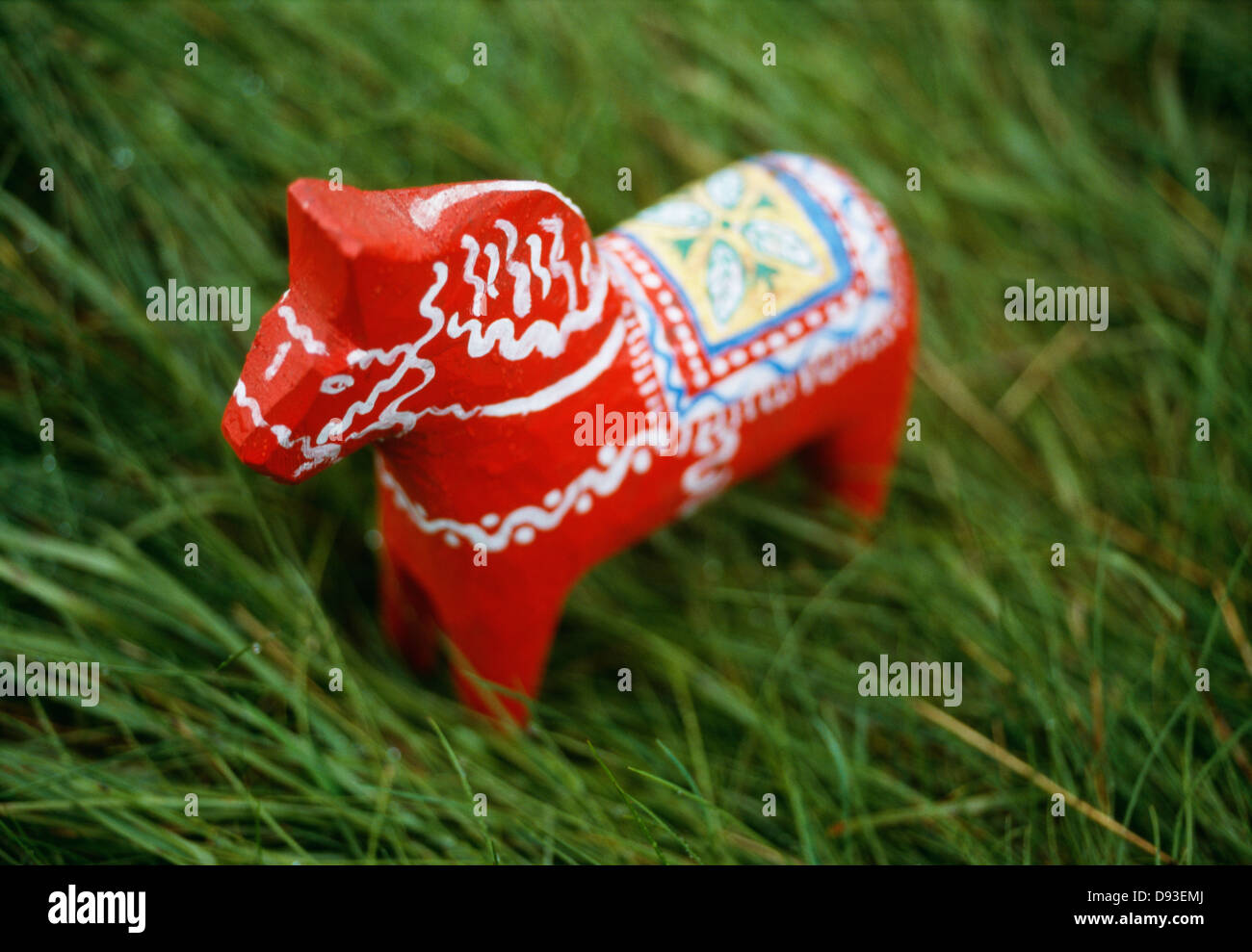 Dalecarlian horse on grass, close-up Stock Photo