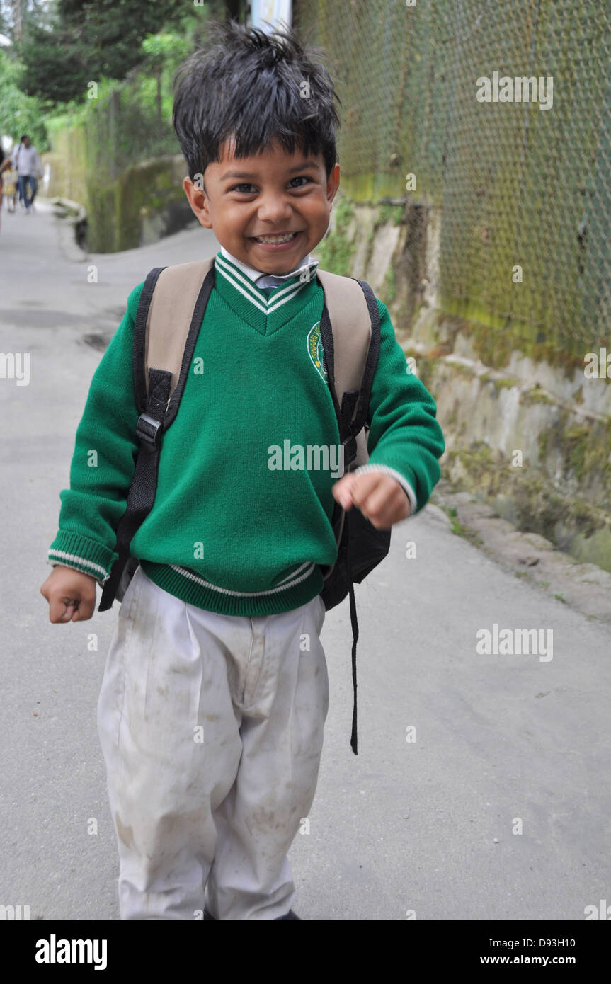 Young child in uniform on the way to school Darjeeling, West Bengal, India Stock Photo