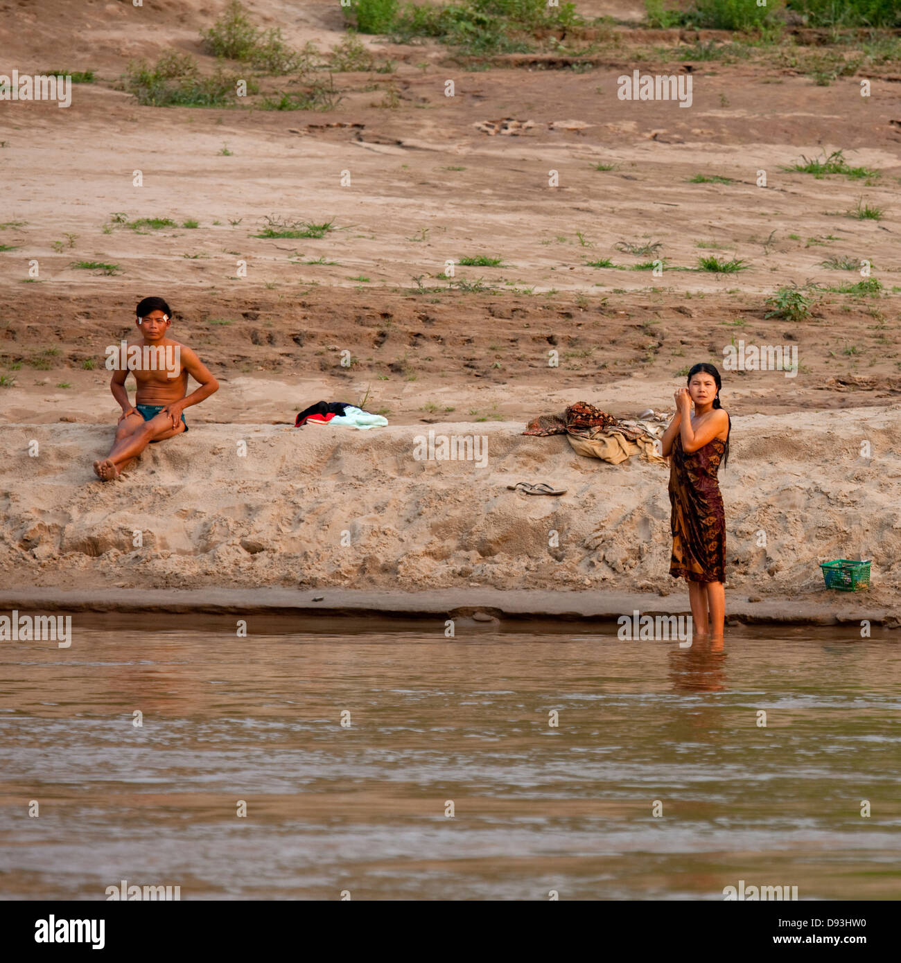 Laotian People Taking Bath On Mekong River, Houei Xay, Laos Stock Photo
