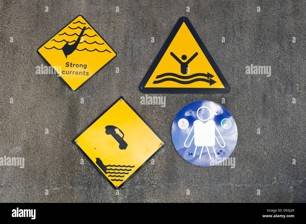 Signs on harbour wall at Giles Quay, County Louth, Republic of Ireland Stock Photo