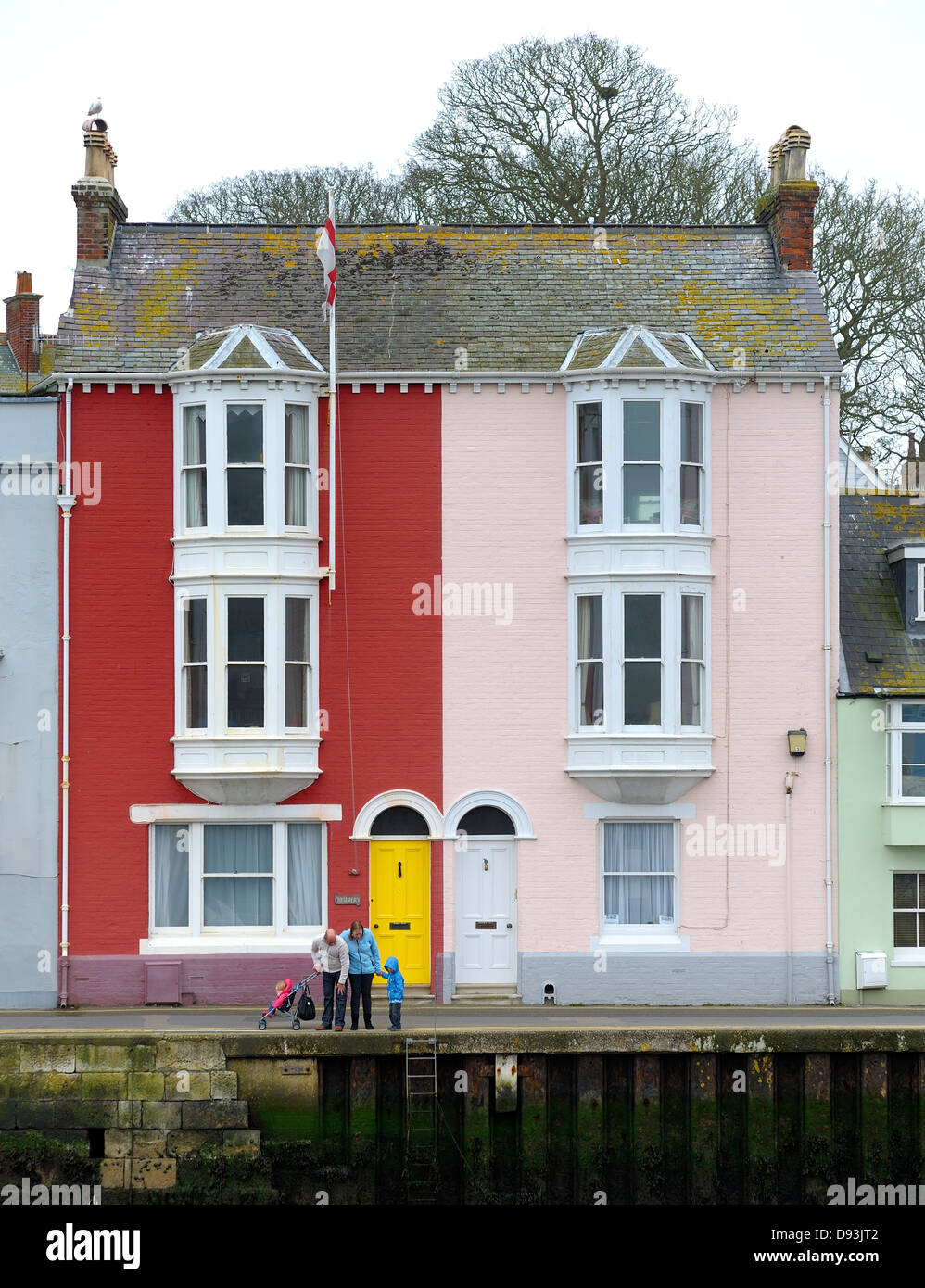 A family looking into the sea in Weymouth harbour Dorset England uk Stock Photo