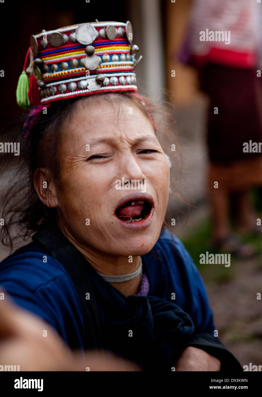 Akha Minority Woman With Traditional Headdress And Black Teeth, Muang Sing, Laos Stock Photo