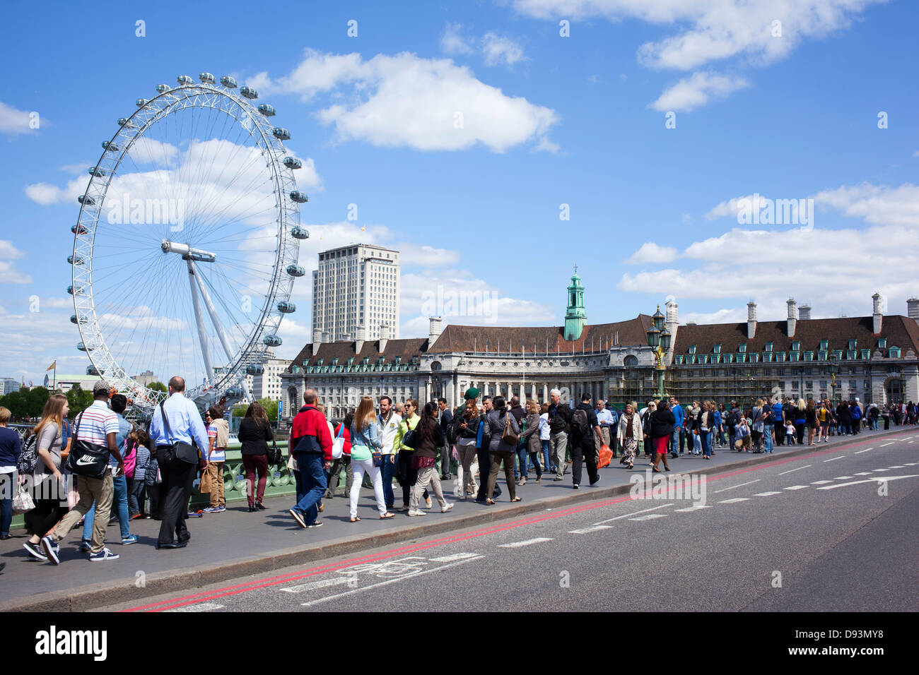 Lots of tourists crossing Westminster bridge, London England. Stock Photo