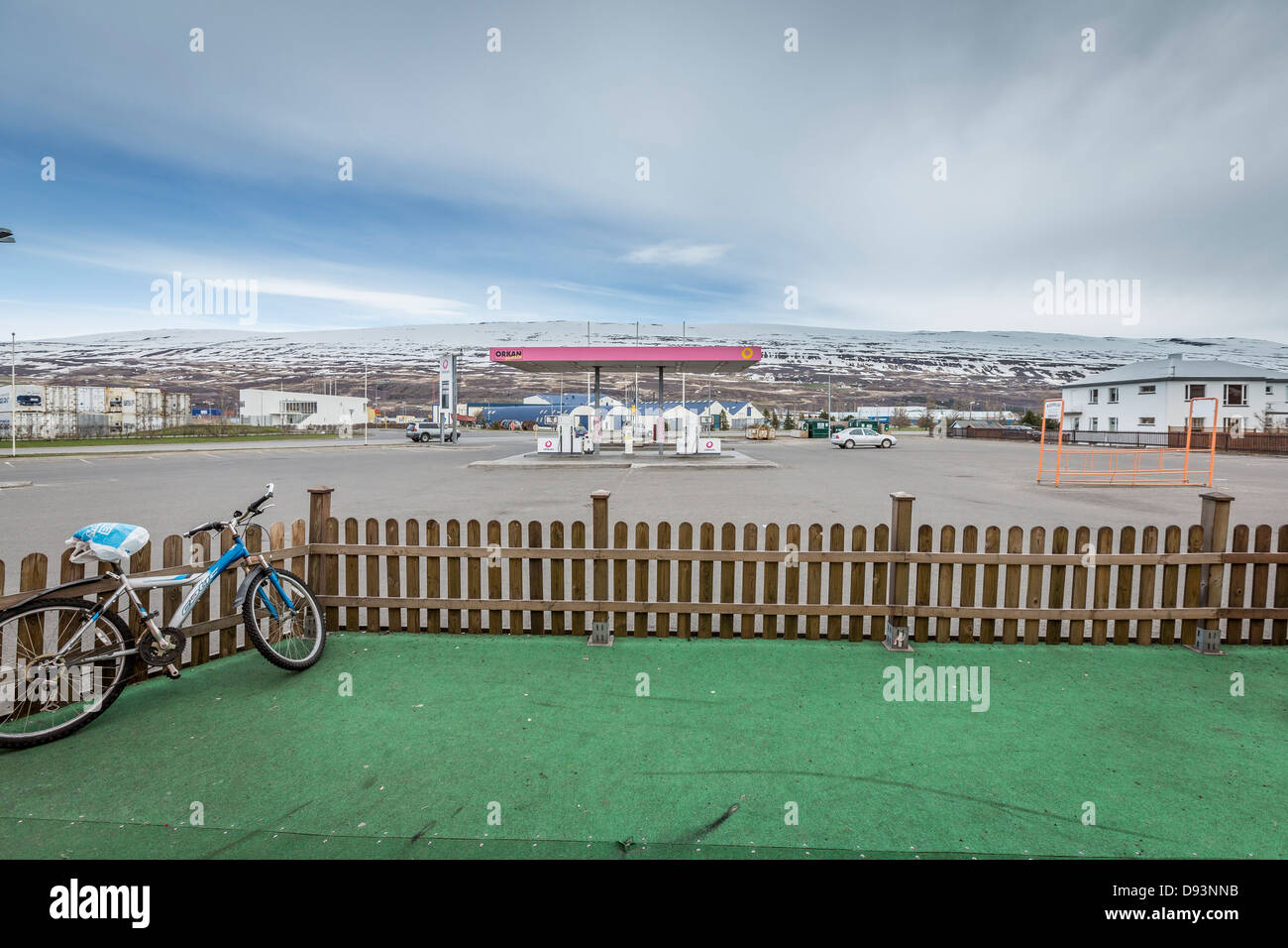 Bike, Fence, Gas Station in  Akureyri, Northern Iceland. Stock Photo