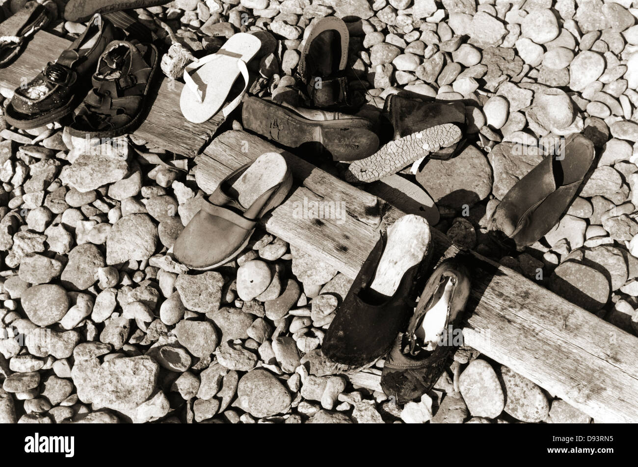 Deserted shoes on a stoney beach Stock Photo Alamy