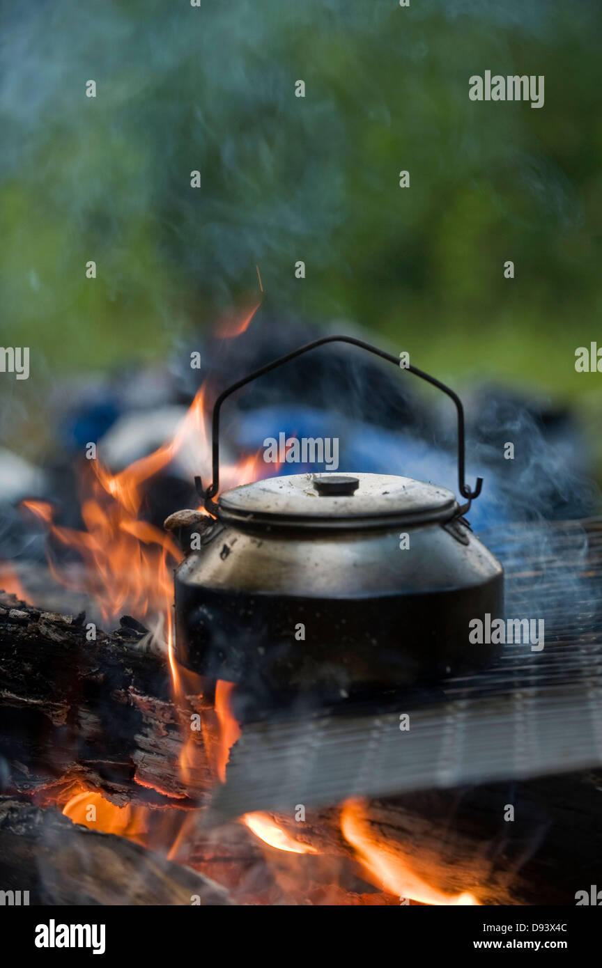 Coffee pot on burning logs Stock Photo Alamy