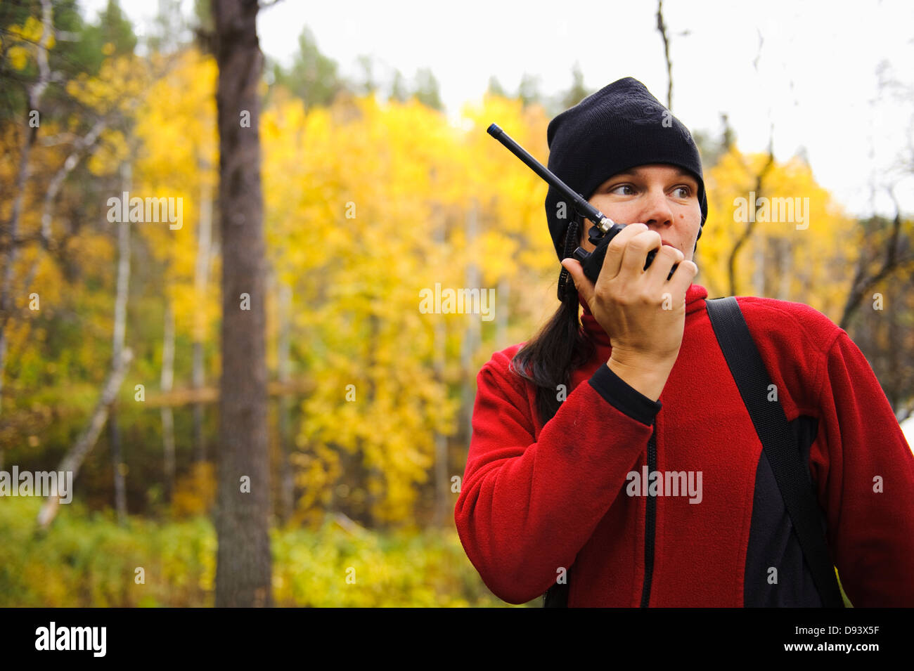 Woman using walkie talkie in forest Stock Photo - Alamy