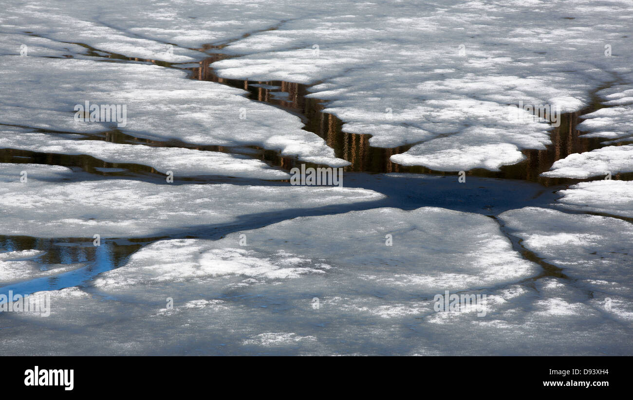 Whirl ice-hole , round vertical hole through an ice-cover formed by the  whirling action of water bleeding up at lake at Spring thaw , Finland Stock  Photo - Alamy