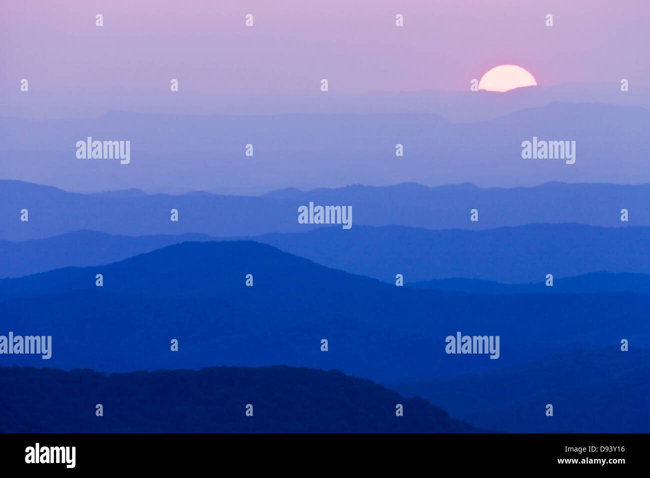 View of sunset over mountain ranges Stock Photo