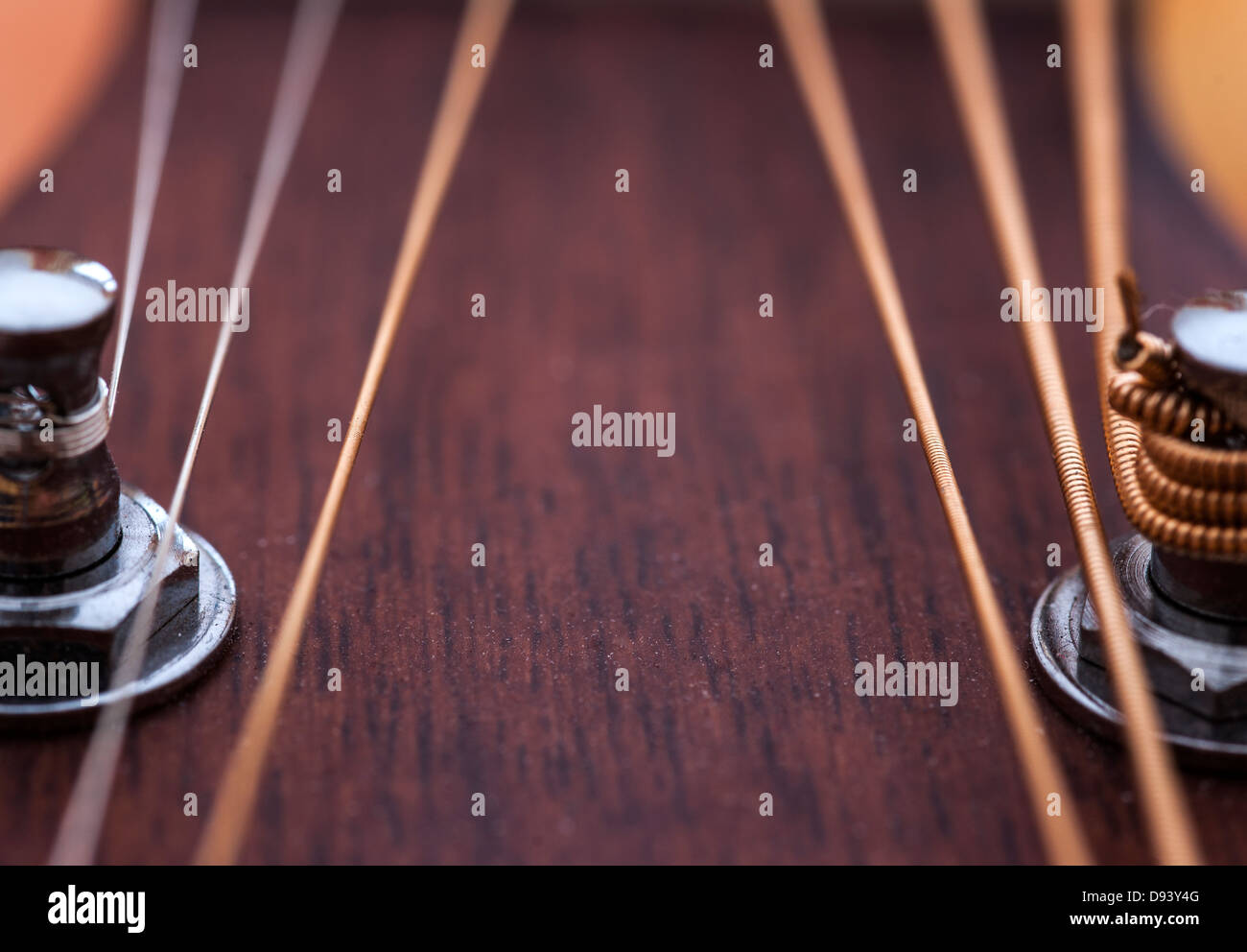 guitar strings looking up through the fret board Stock Photo