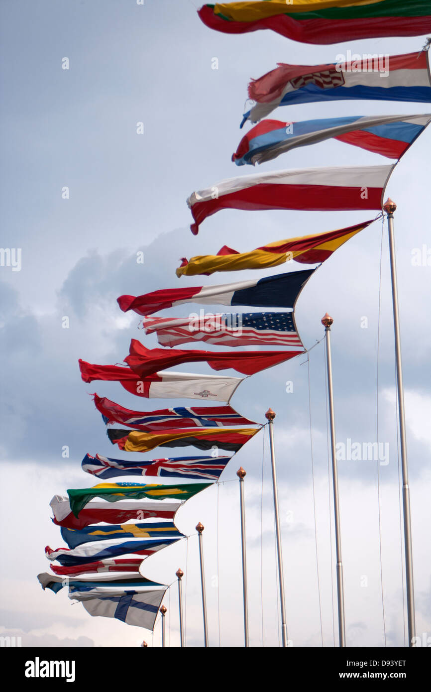 Row of national flags blowing in wind Stock Photo