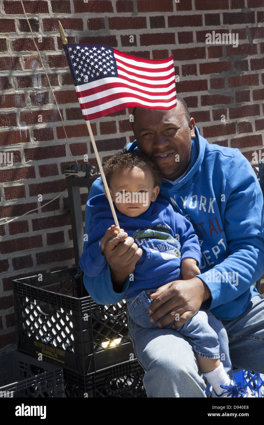 Father and son watch the Memorial Day Parade in Bay Ridge Brooklyn, NY
