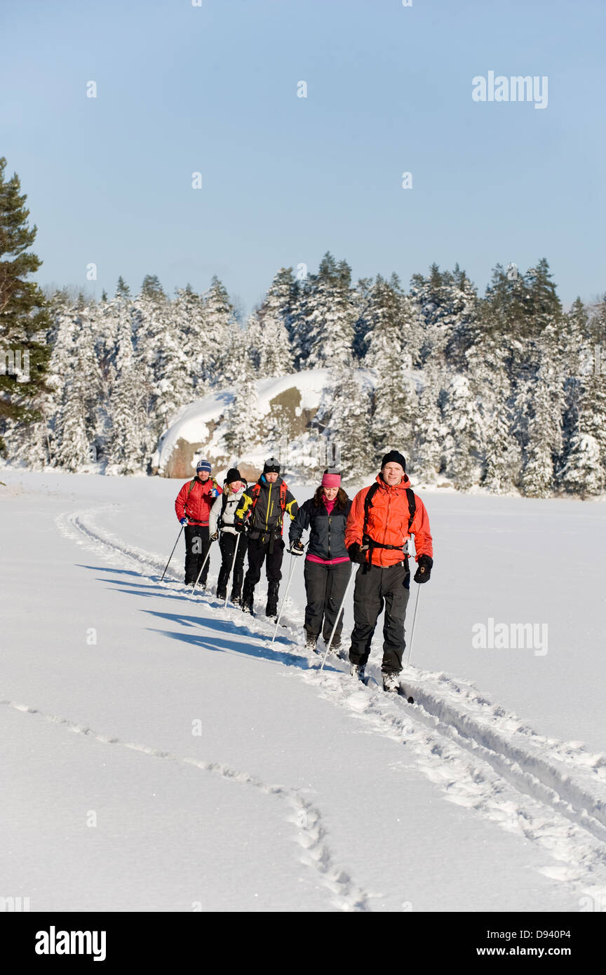 Six people cross country skiing Stock Photo