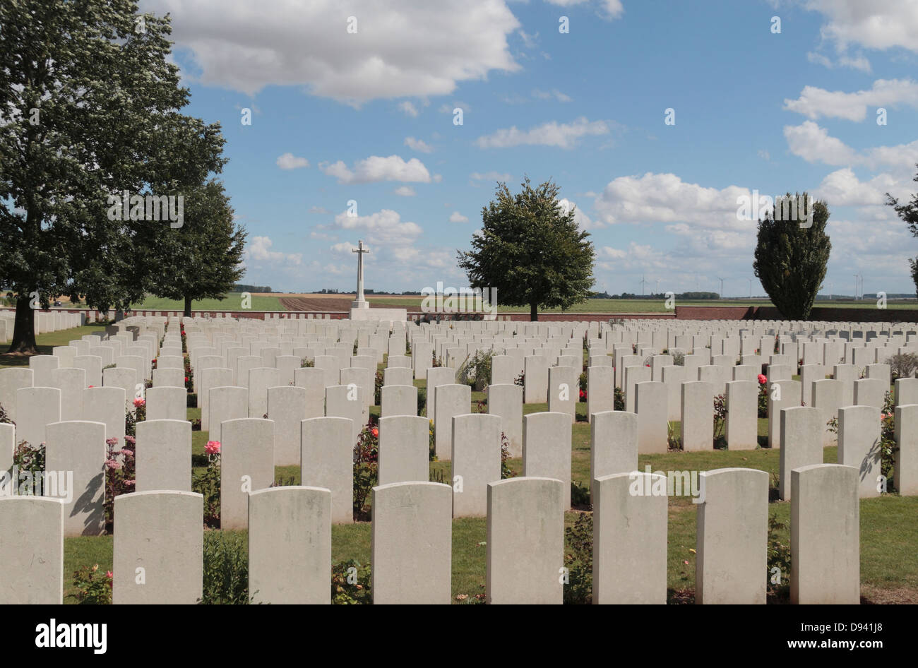 Cross of Sacrifice and rows of headstones in the CWGC Heath Cemetery, Harbonnieres, Somme, Picardy, France. Stock Photo