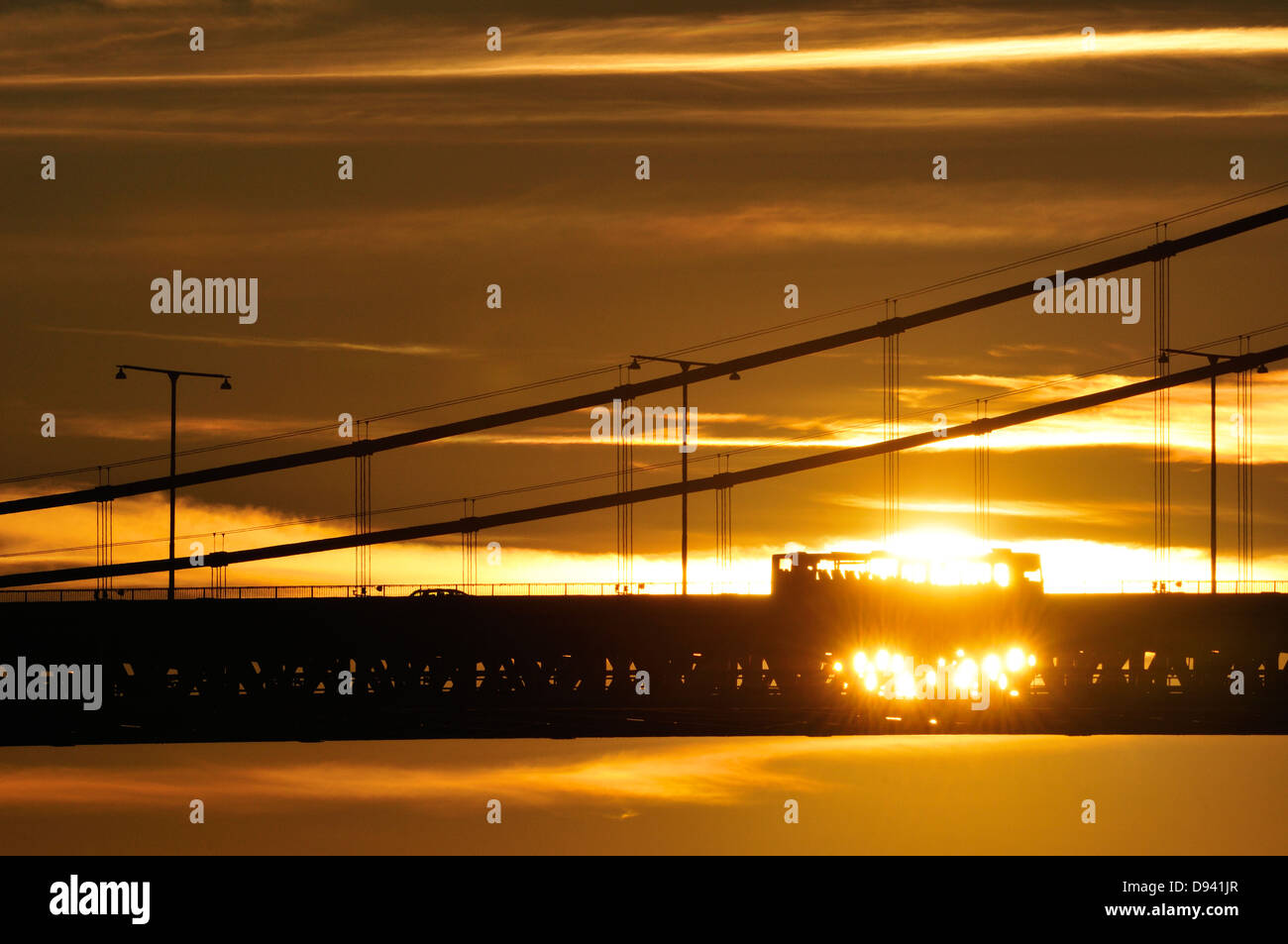 Silhouette of bridge at sunset Stock Photo - Alamy