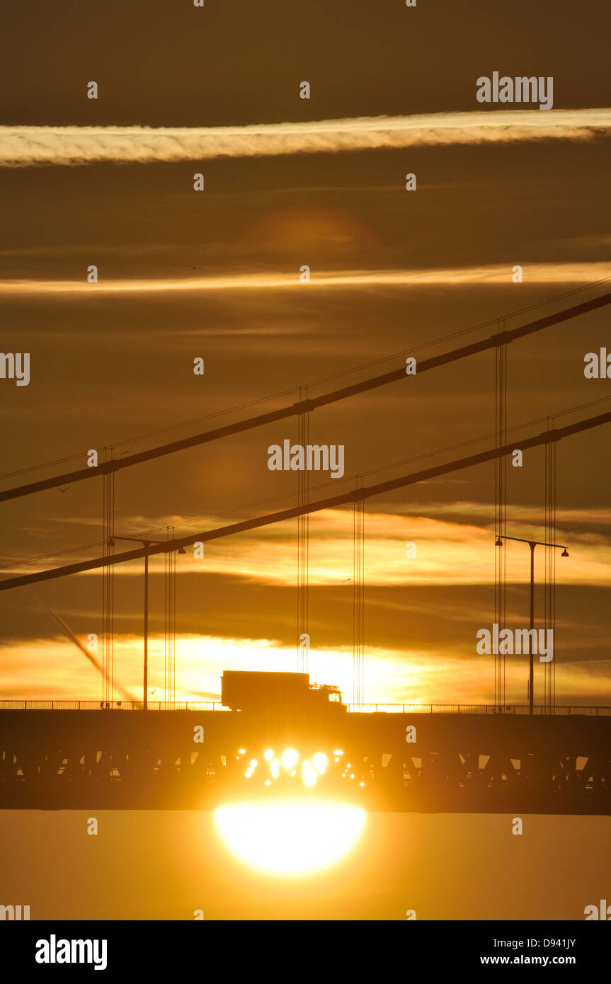 Silhouette of bridge at sunset Stock Photo - Alamy