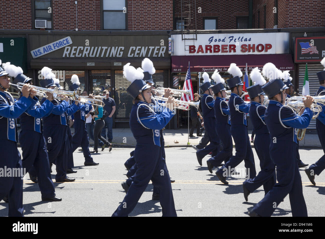 High school marching band pass a local military recruitment office during the Memorial Day Parade in Bay Ridge, Brooklyn, NY. Stock Photo