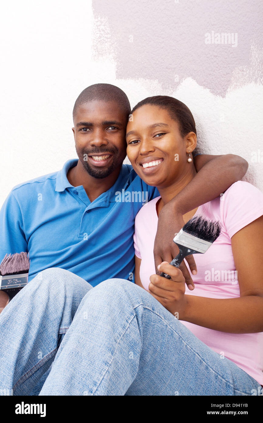 happy African couple painting new home Stock Photo - Alamy