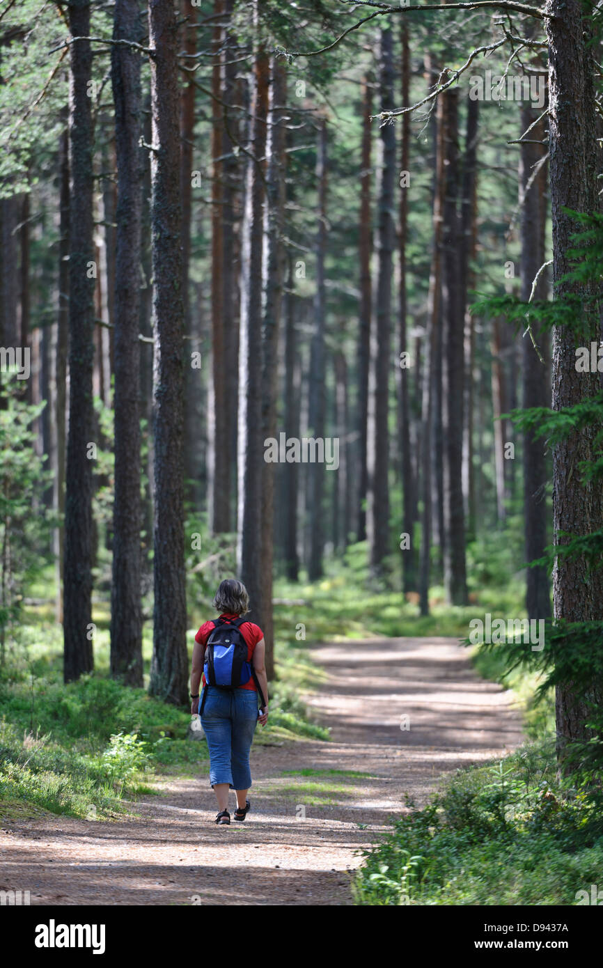 Woman walking along pathway hi-res stock photography and images - Alamy