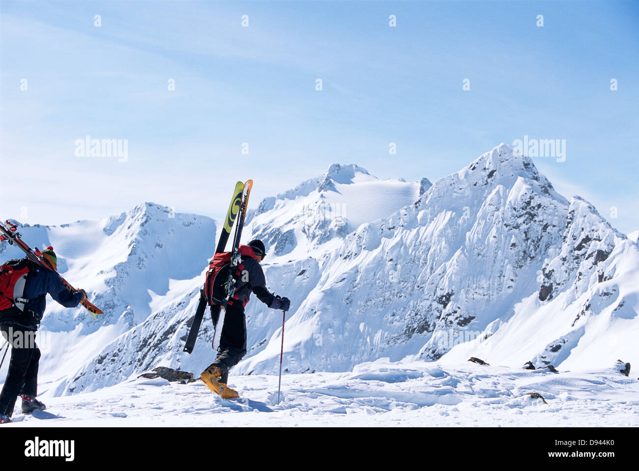 Two skiers walking towards the top, St:Anton, Austria. Stock Photo