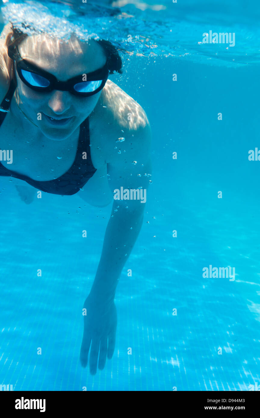 Woman swimming in swimming pool, underwater view Stock Photo - Alamy