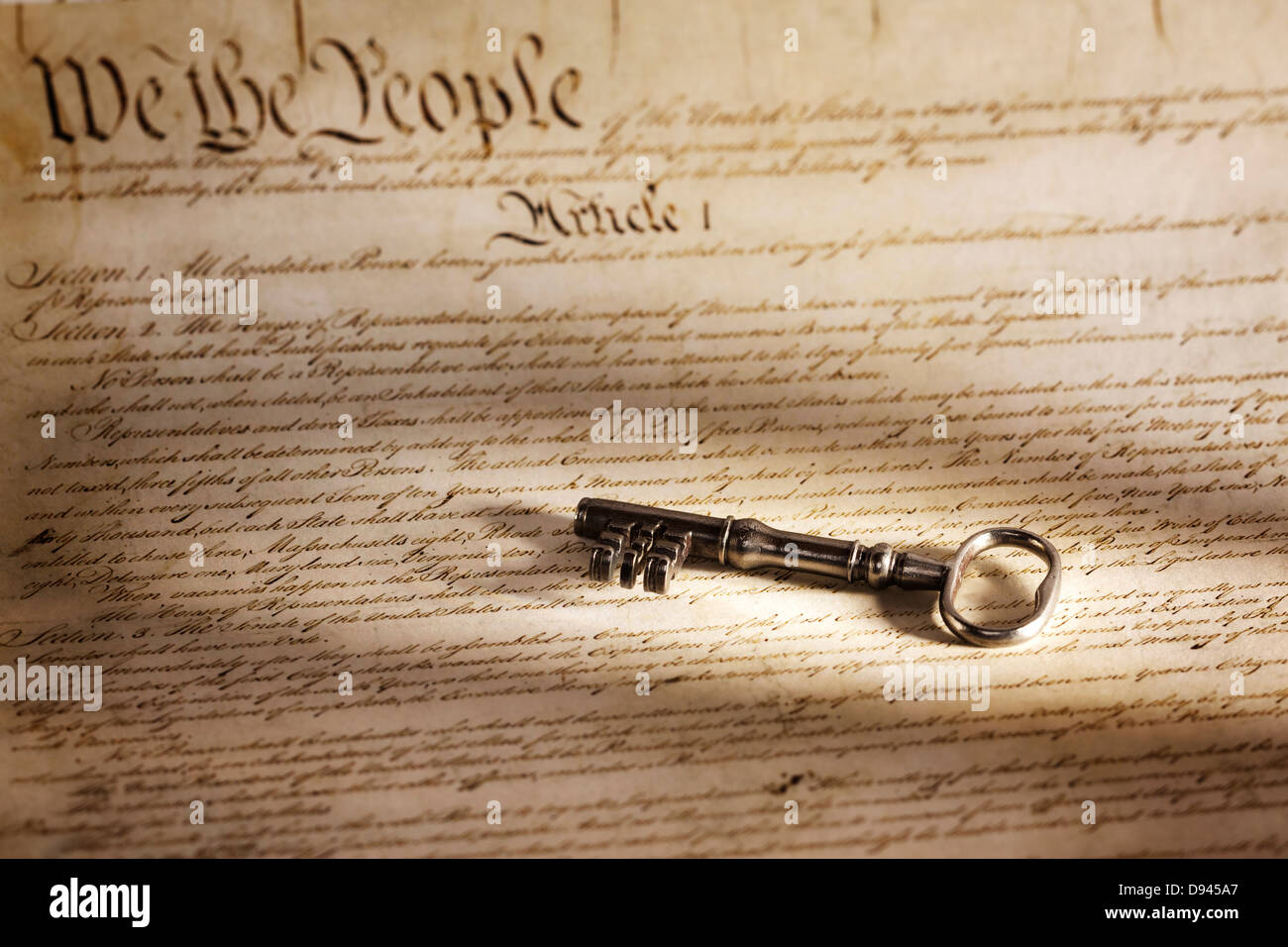 Key to the American Constitution - a large key on a copy of the American constitution. Stock Photo