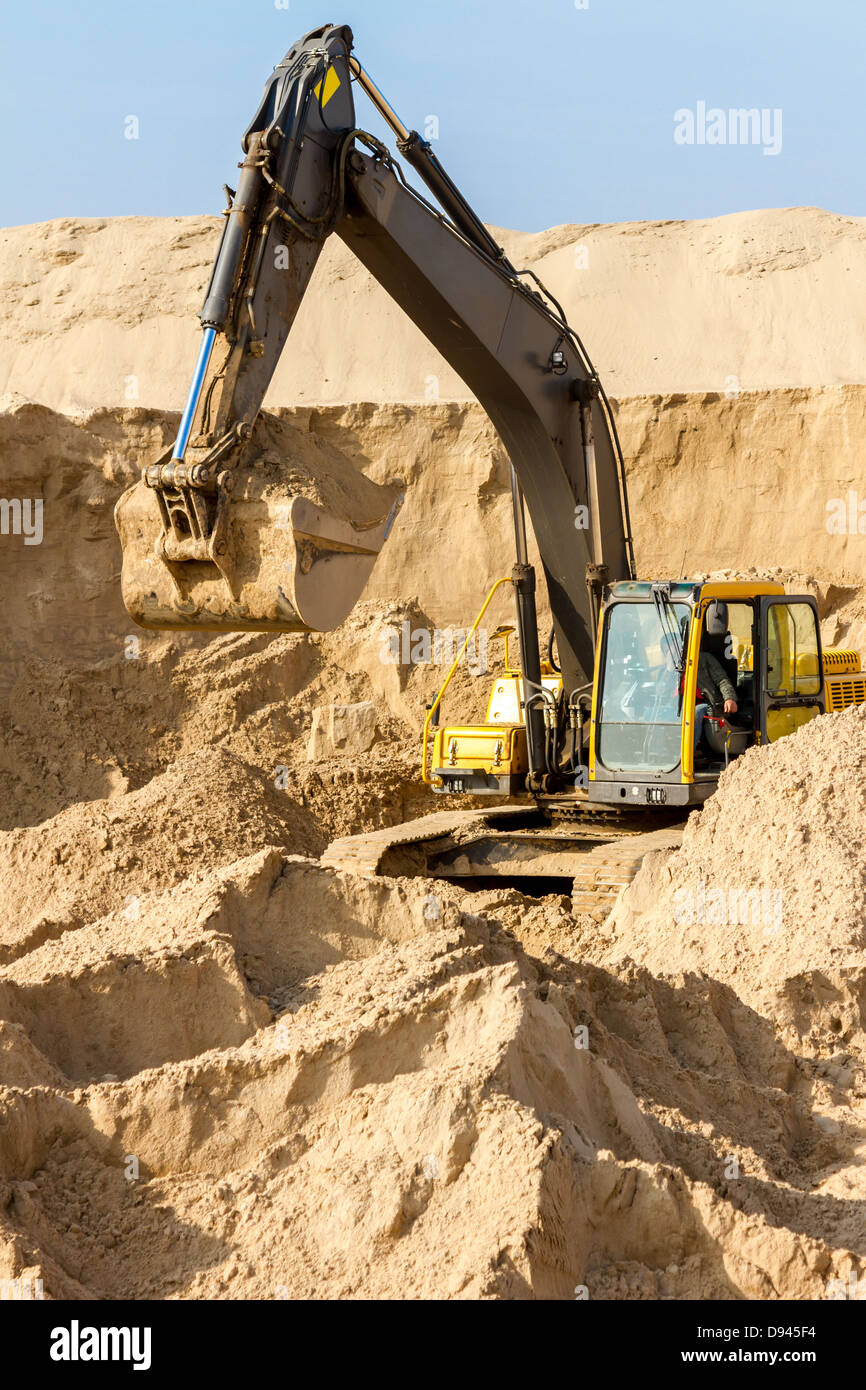 Working Yellow Excavator at Construction Site Stock Photo - Alamy