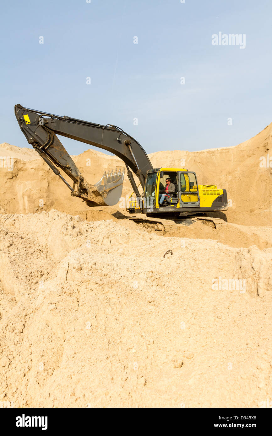 Working Yellow Excavator at Construction Site Stock Photo - Alamy