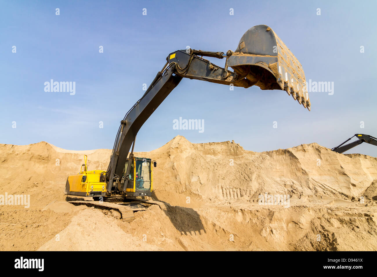 Working Yellow Excavator at Construction Site Stock Photo - Alamy