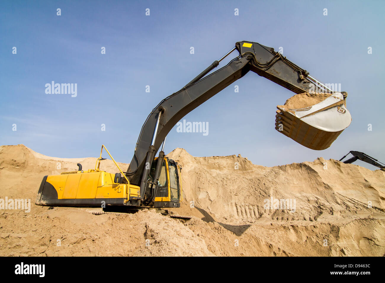 Working Yellow Excavator at Construction Site Stock Photo - Alamy