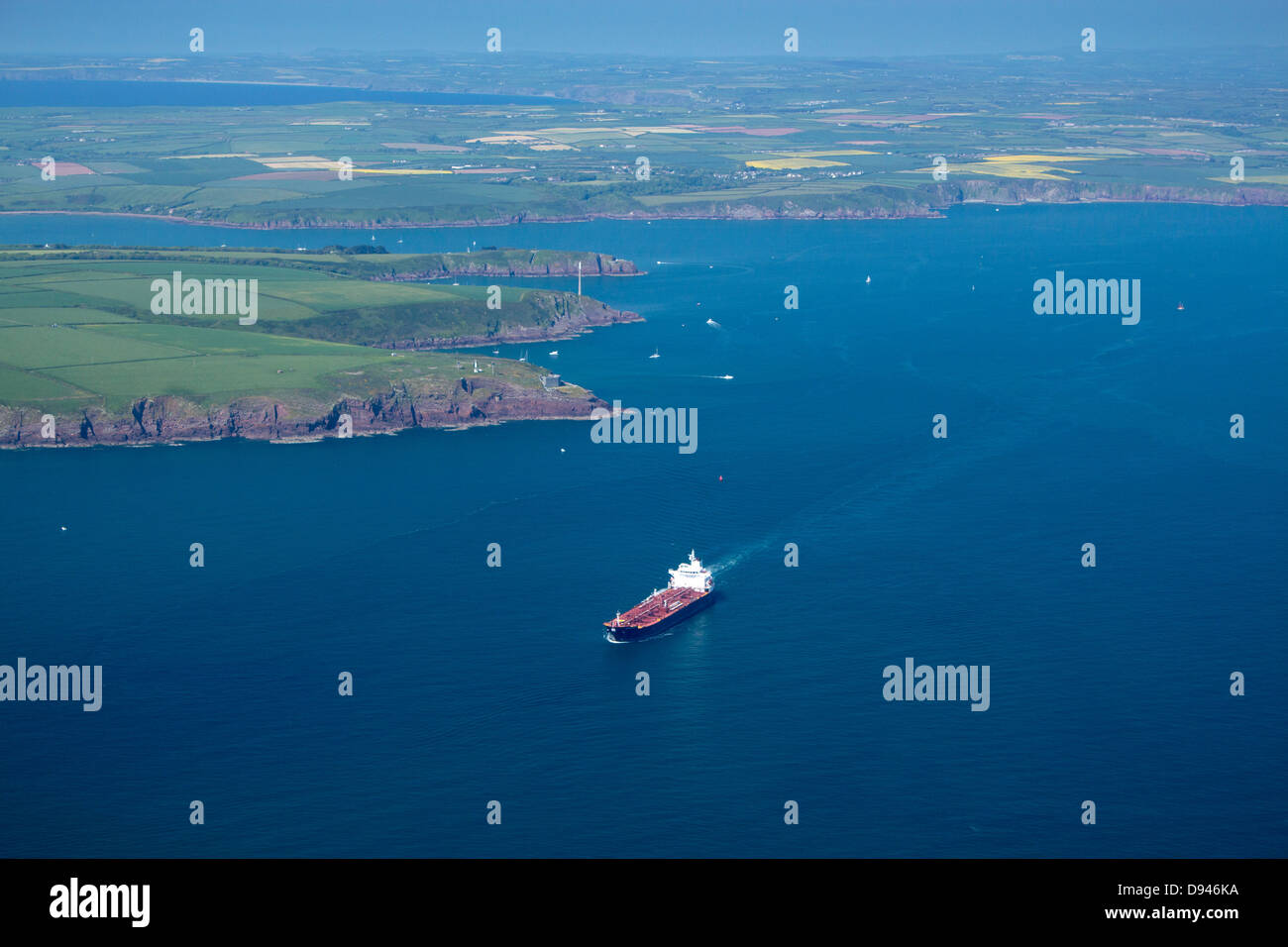 Oil tanker leaving Milford Haven Daugleddau estuary Aerial view Pembrokeshire West Wales UK Stock Photo