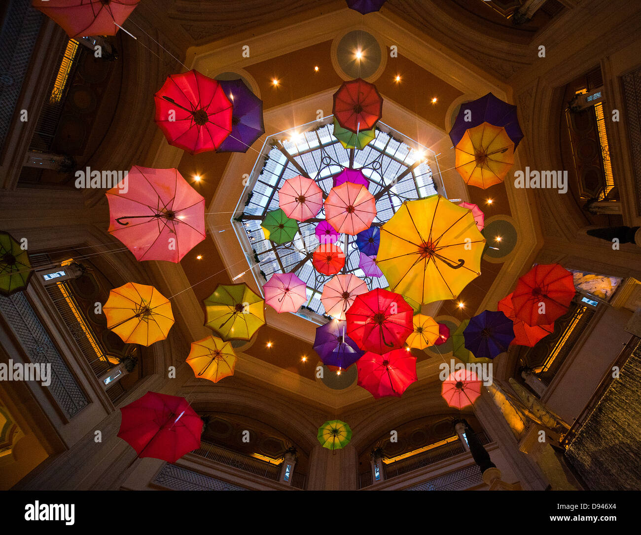 Multi colored umbrellas hanging in building Stock Photo Alamy