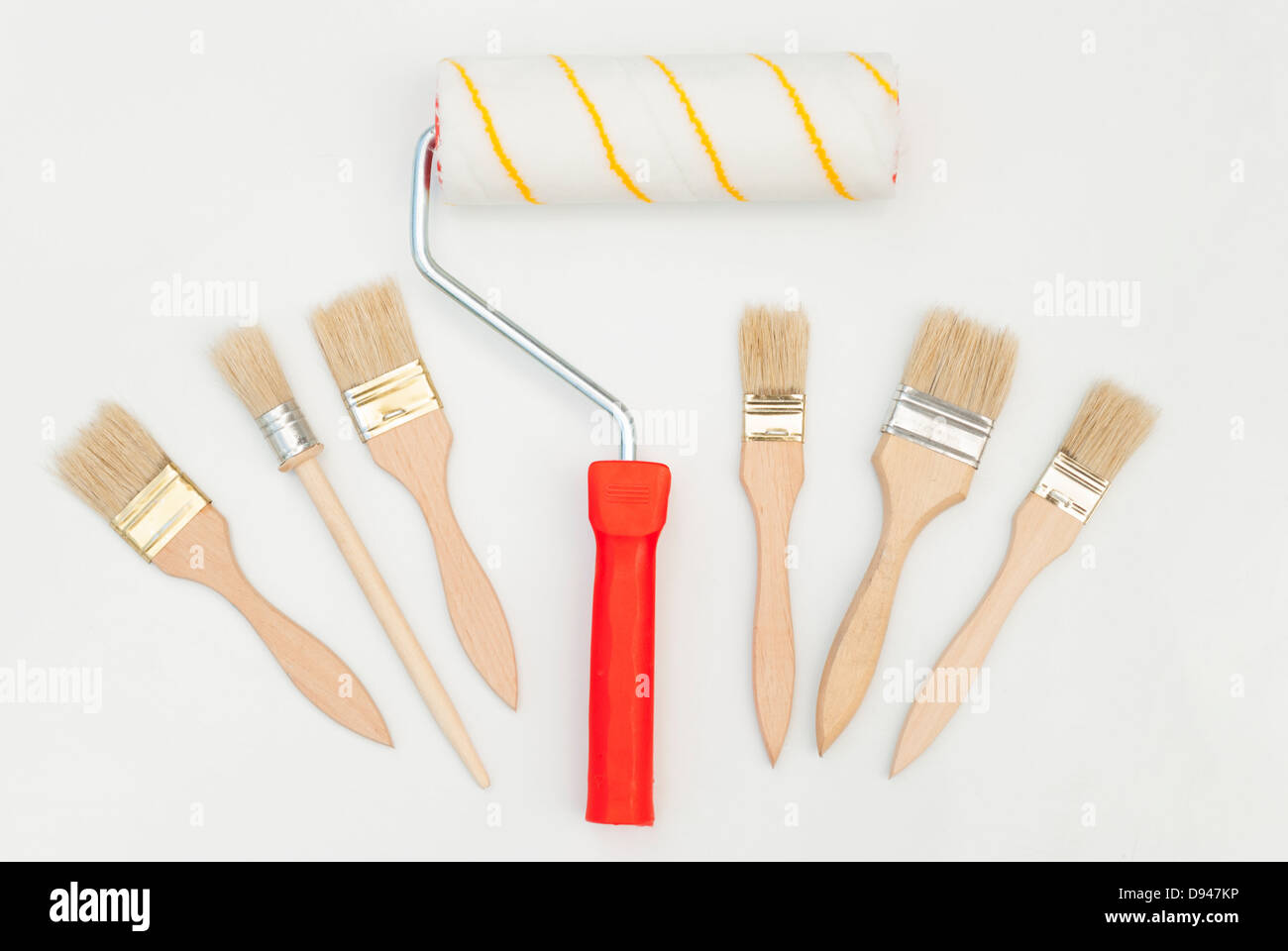 Paint roller and brush on a white background Stock Photo - Alamy