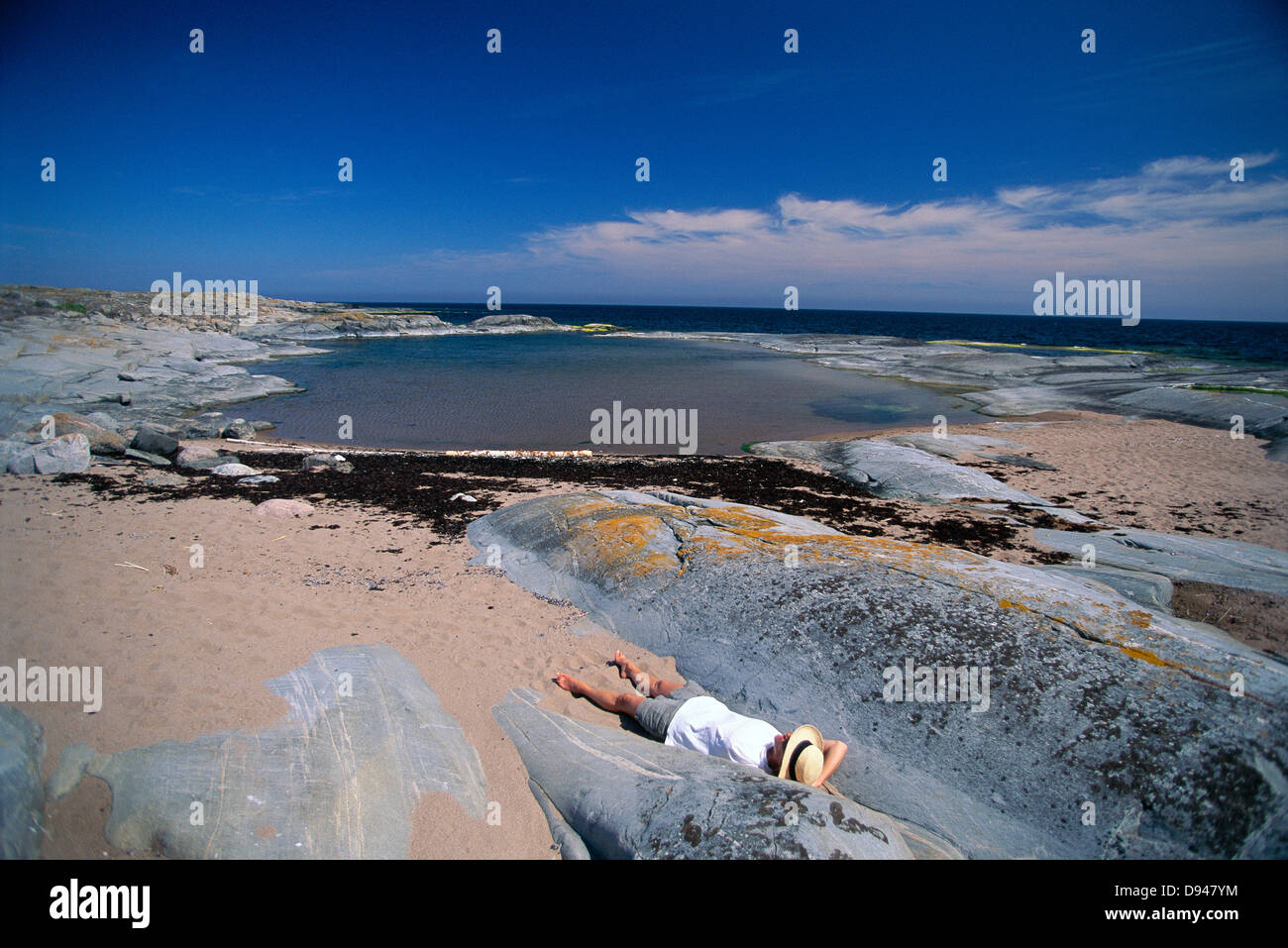 Woman resting on cliffs, Stockholm archipelago, Sweden Stock Photo Alamy