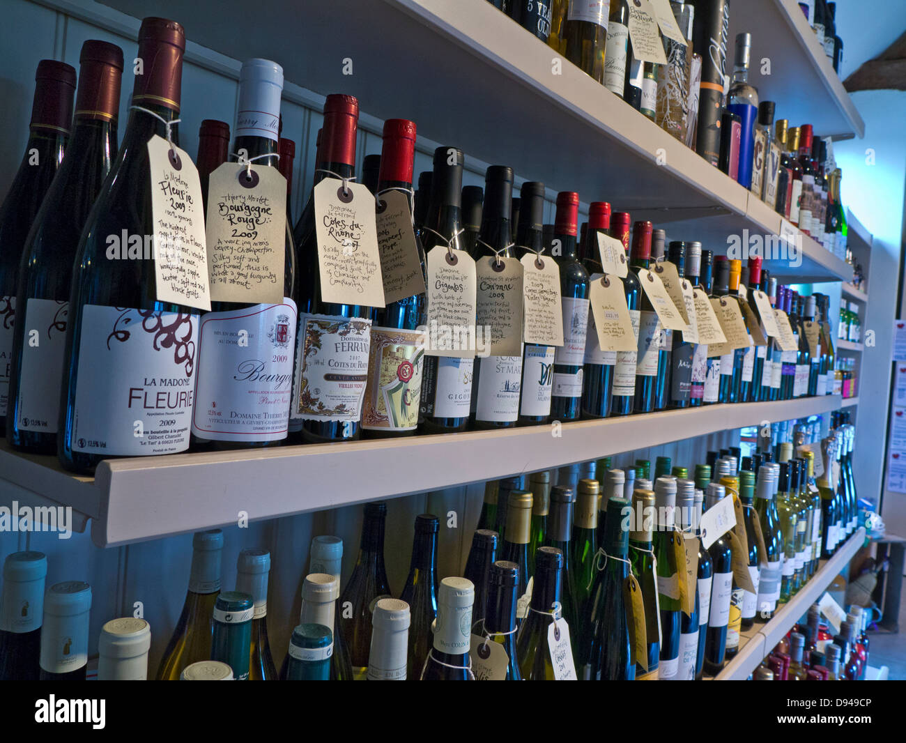 Variety of wine bottles on display for sale in rural farm shop with