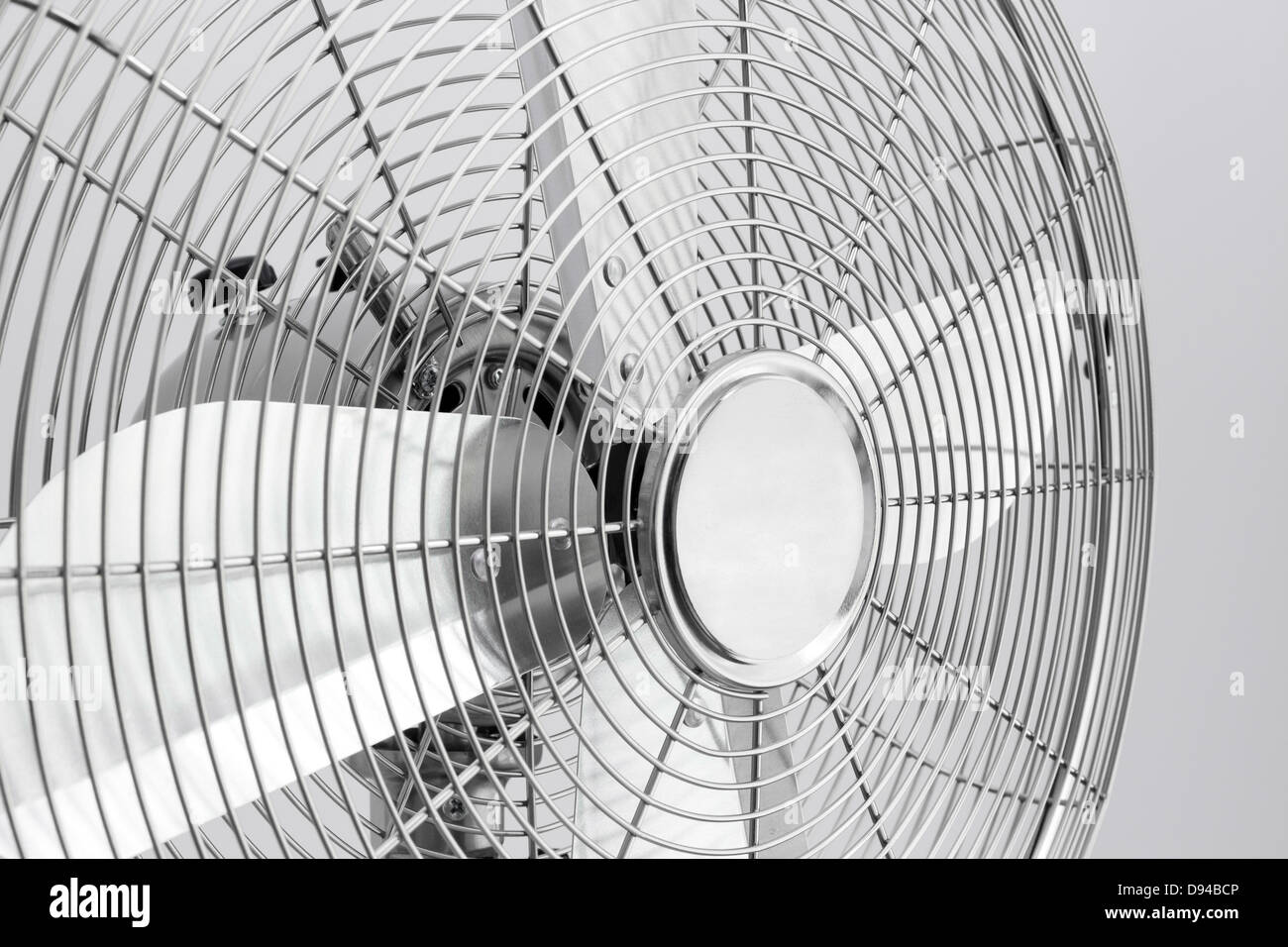 Detail of a modern metal electric fan with shiny blades. Stock Photo