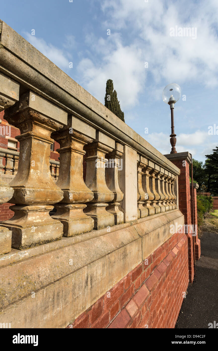 Decorative balcony rail risers at Sunbury Lunatic Asylum first opened in October 1879, now used as Hume Anglican Grammar School Stock Photo