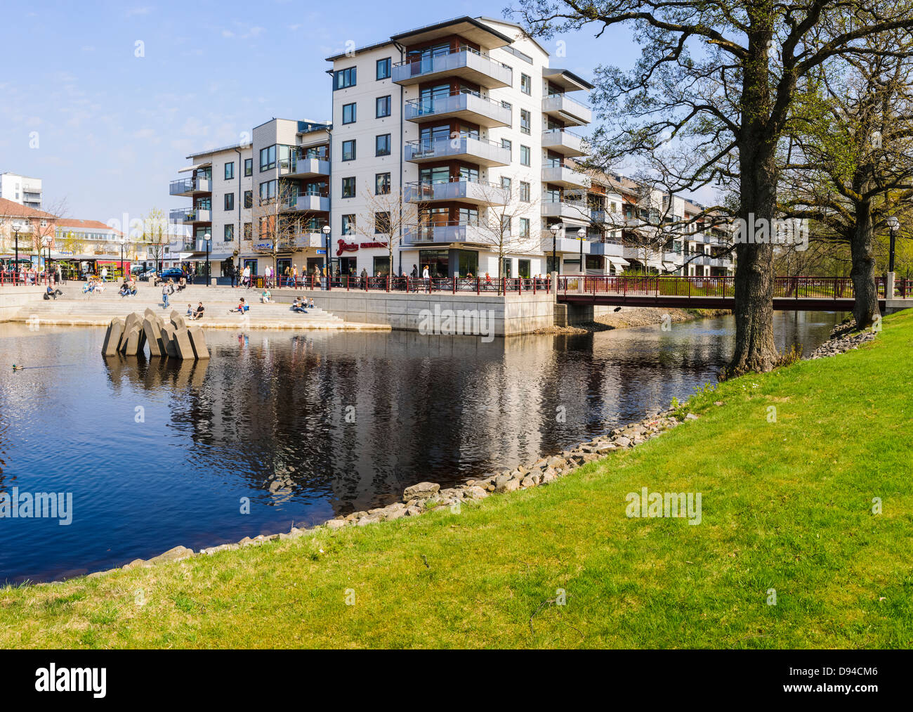 Apartment buildings by canal Stock Photo