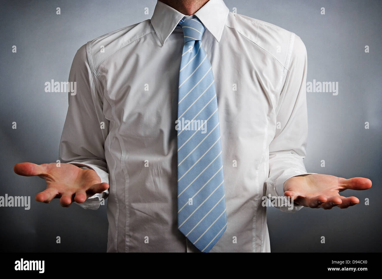 Image of a man wearing a tie making a gesture Stock Photo