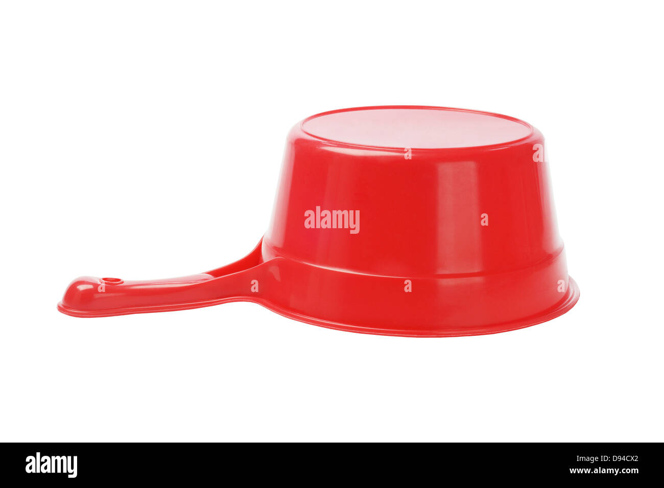 Inverted Red Plastic Scoop On White Background Stock Photo