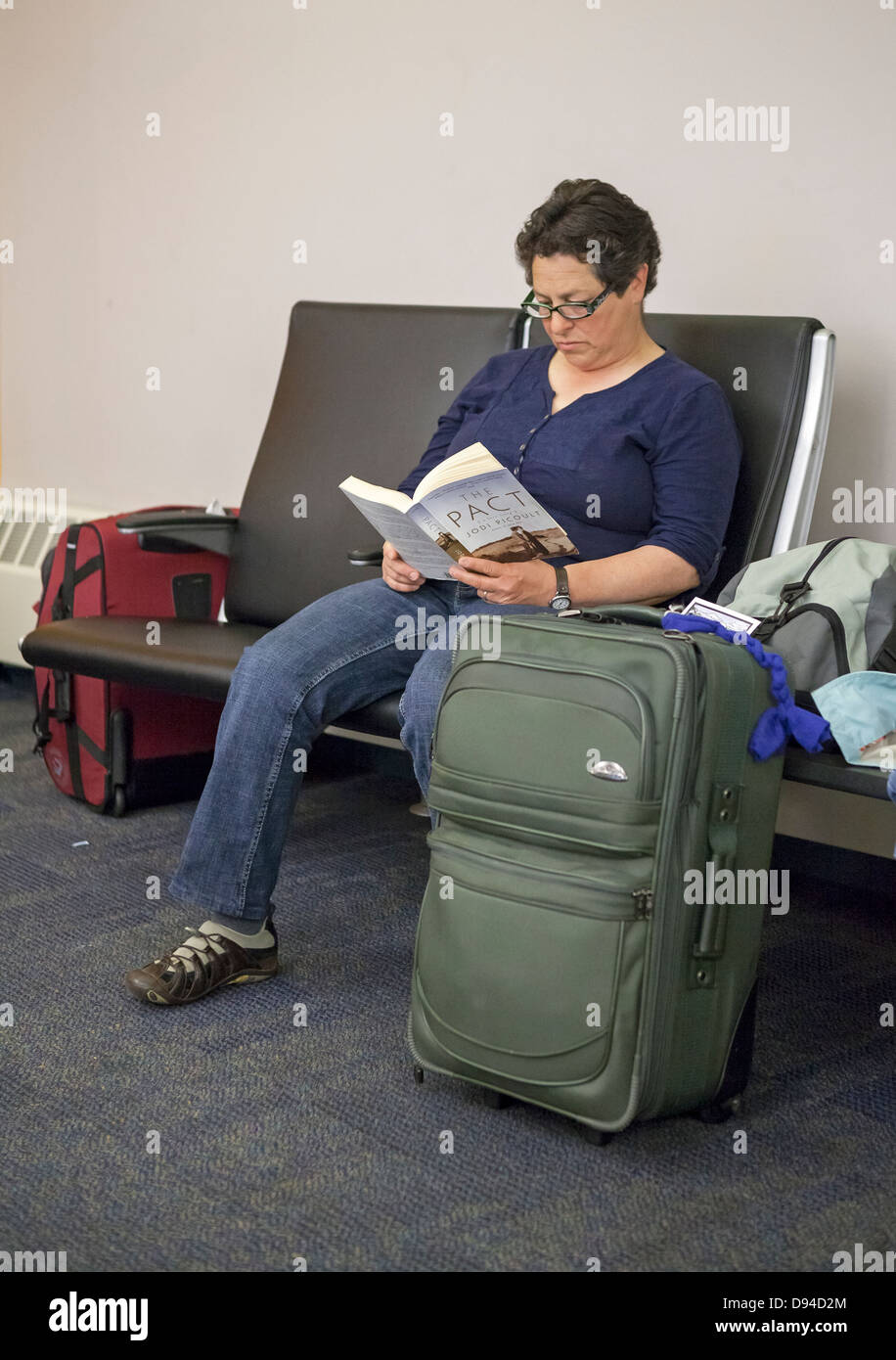 Waiting airport reading hi-res stock photography and images - Alamy