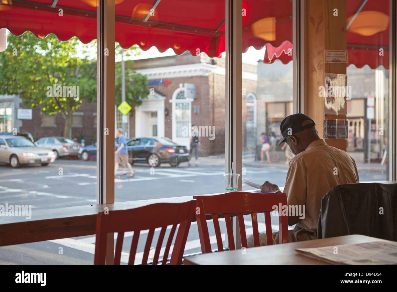 A man sits alone in a restaurant in Boston. Stock Photo
